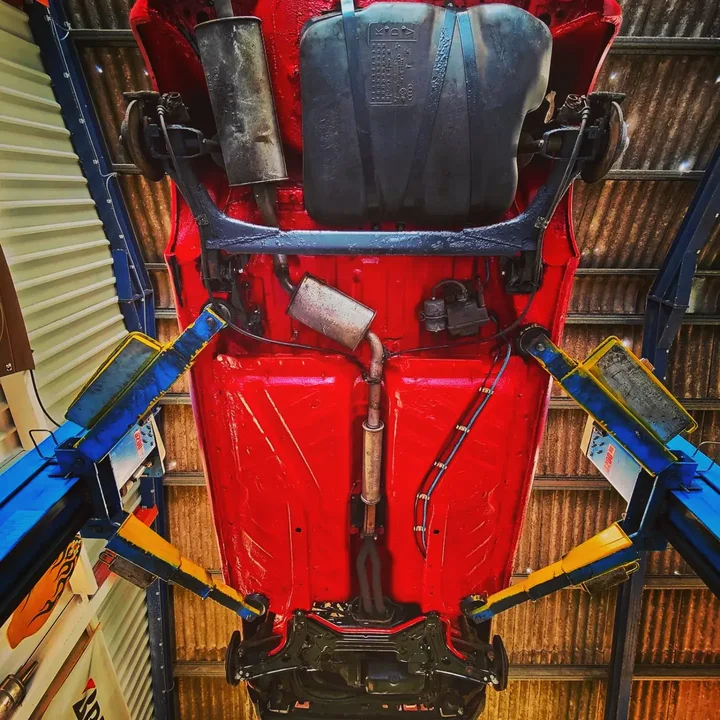 Vehicle underside photographed on the workshop lift.